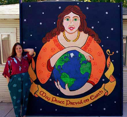 Rowan standing next to the finished mural